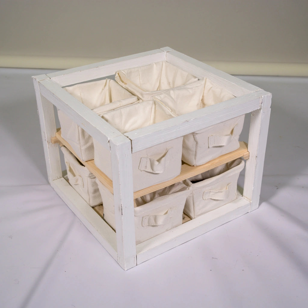 White wooden children's storage unit from coatandcatchall, minimalist children's furniture for organized playroom or bedroom storage.