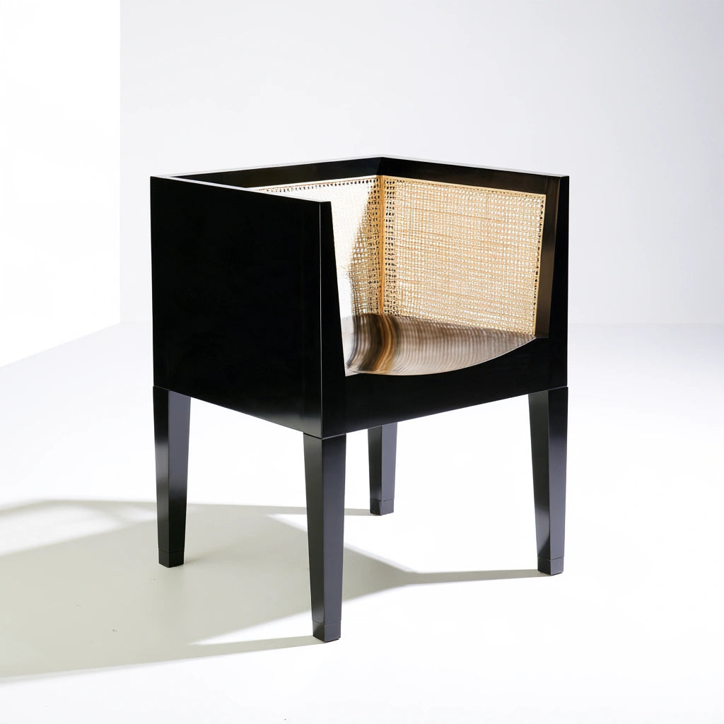 Black wooden dining chair from coatandcatchall, minimalist design with smooth finish and ergonomic shape for stylish comfort.