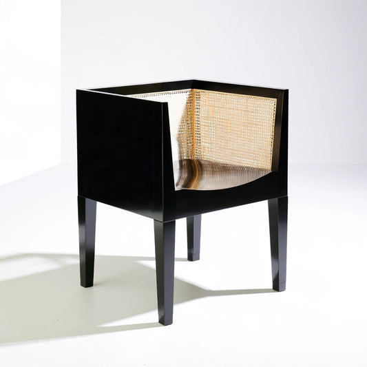 Black wooden dining chair from coatandcatchall, minimalist design with smooth finish and ergonomic shape for stylish comfort.